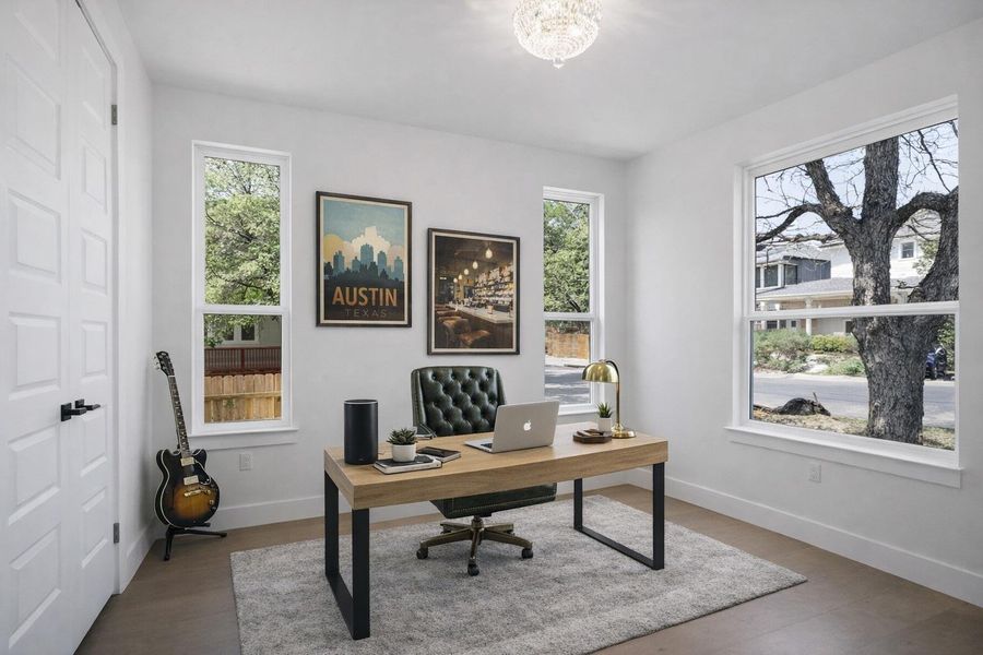 Office space with plenty of natural light and wood finished floors. Virtually Staged.