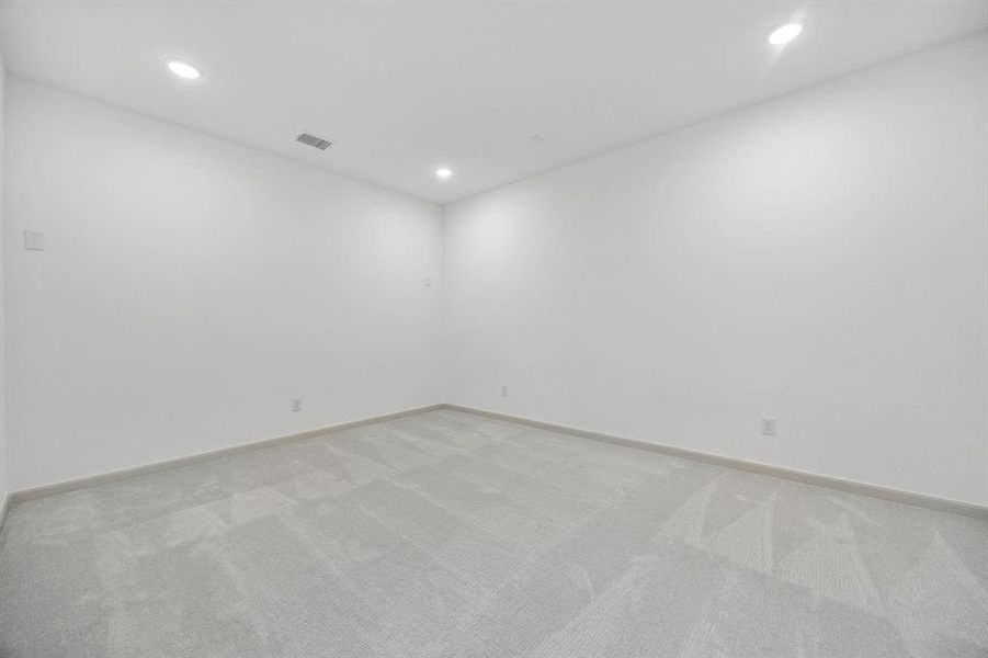 This spacious media room with adjacent game room create the ultimate entertainment zone!