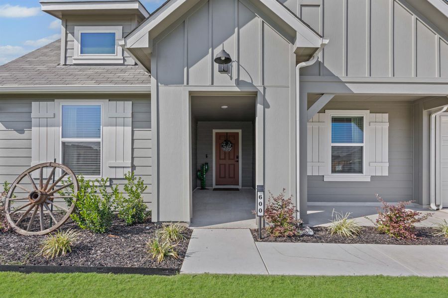 Front exterior of a new home in Hartland Ranch, Lockhart, TX, highlighting curb appeal (Image 20). Front exterior of a new home in Hartland Ranch, Lockhart, TX, highlighting curb appeal (Image 20).