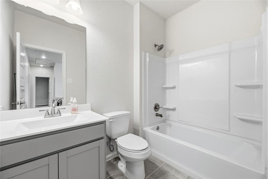 Upstairs bathroom off of the game room. Upstairs bathroom off of the game room.