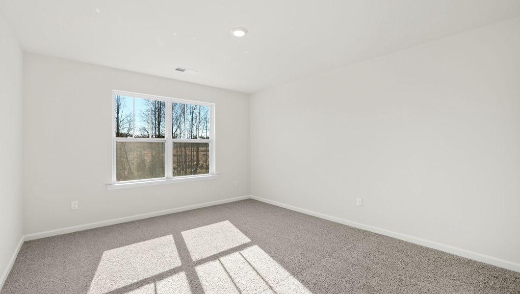 Representative unfurnished interior of a home built from the WILMINGTON by D.R. Horton in Benjamin's Grove, Woodruff (Image 23).