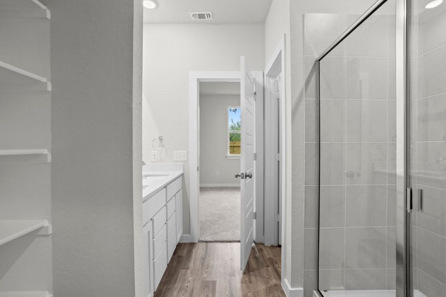 A bathroom with a glass shower.