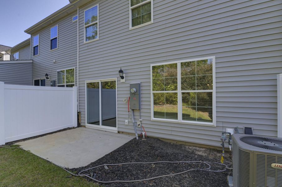 Exterior details and patio area of a home in Kensington Place Townhomes, Lexington (Image 3).