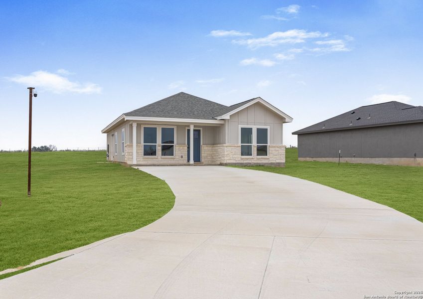 Front exterior of a new home in , La Vernia, TX, highlighting curb appeal (Image 18).