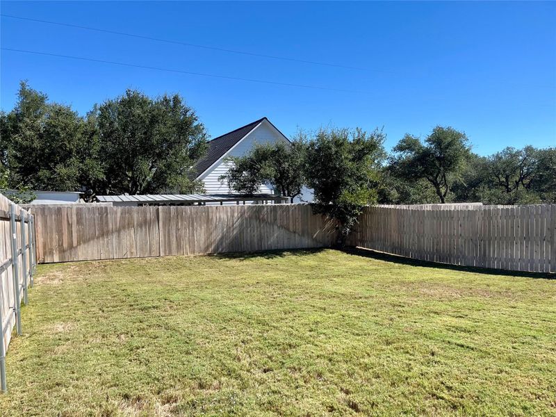 View of fenced backyard