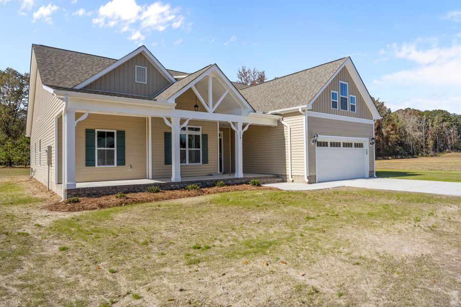 Front exterior of a new home in Kennedy's Crossing, Grimesland, NC, highlighting curb appeal (Image 21).