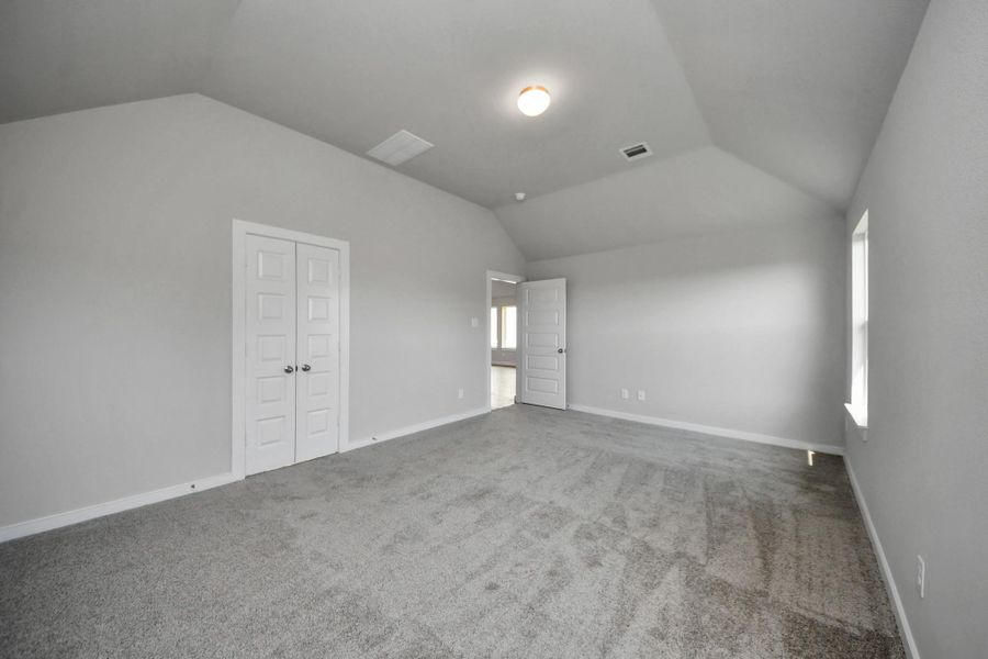 Escape and relax in the exquisite primary suite, a haven to unwind after a long day. The spacious room boasts plush carpeting, soothing paint tones, high ceilings, and expansive windows adorned with privacy blinds. Sample photo of completed home with similar floor plan. Actual colors and selections may vary. Escape and relax in the exquisite primary suite, a haven to unwind after a long day. The spacious room boasts plush carpeting, soothing paint tones, high ceilings, and expansive windows adorned with privacy blinds. Sample photo of completed home with similar floor plan. Actual colors and selections may vary.