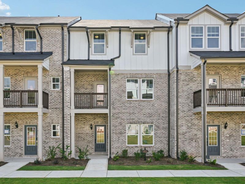 Front exterior of a new home in Martin Springs - Highland Series, Lawrenceville, GA, highlighting curb appeal (Image 1).