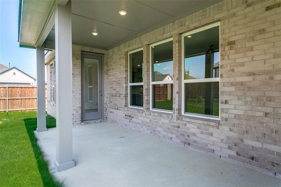 Exterior details and patio area of a home in The Preserve Estates, Justin (Image 20).