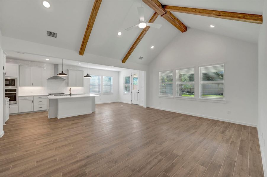 Impressive great room with high vaulted ceilings and stained beams Impressive great room with high vaulted ceilings and stained beams