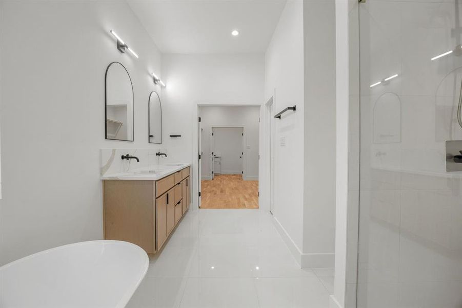 From the designer-inspired bathroom, you’ll find a seamless transition into the spacious walk-in closet and conveniently connected laundry room, creating a thoughtfully designed layout that blends luxury with everyday functionality. From the designer-inspired bathroom, you’ll find a seamless transition into the spacious walk-in closet and conveniently connected laundry room, creating a thoughtfully designed layout that blends luxury with everyday functionality.
