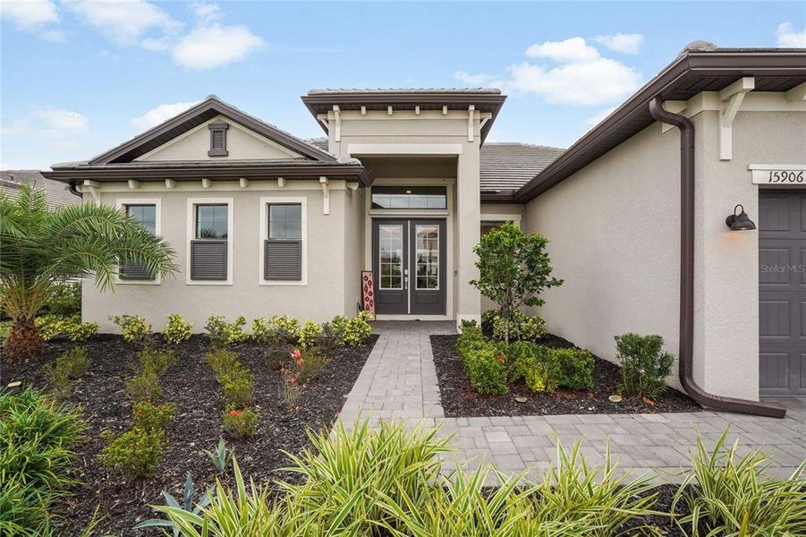 Front exterior of a new home in , Lakewood Ranch, FL, highlighting curb appeal (Image 25). Front exterior of a new home in , Lakewood Ranch, FL, highlighting curb appeal (Image 25).