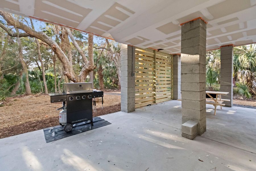 Exterior details and patio area of a home in , Edisto Island (Image 25).