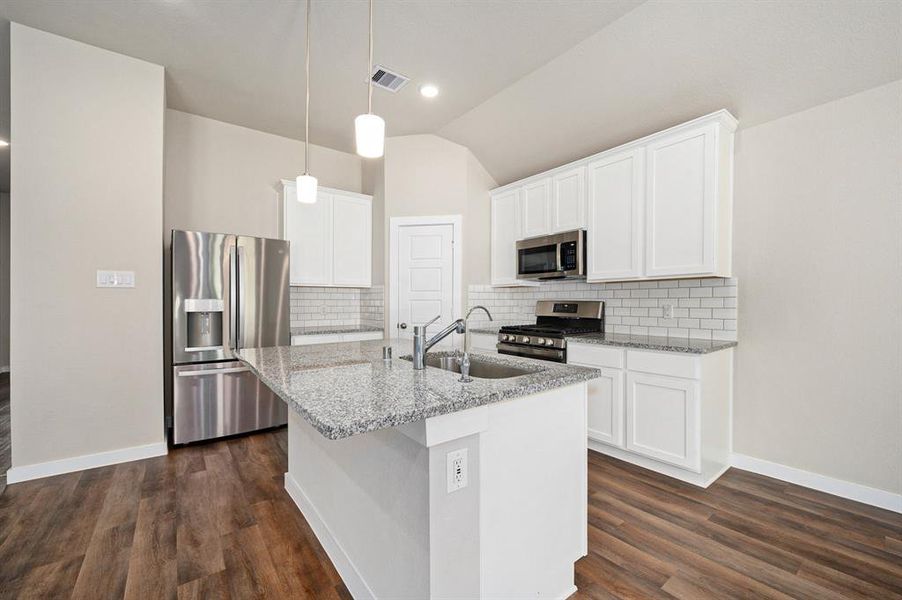 Open concept living space/ kitchen /dining area.