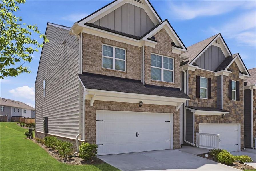 Front exterior of a new home in , Buford, GA, highlighting curb appeal (Image 23).