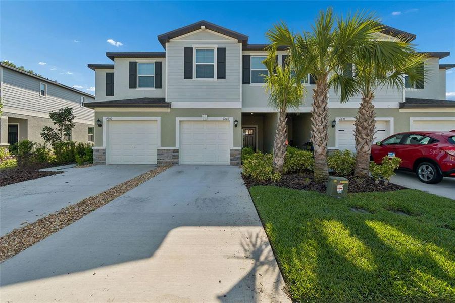 Front exterior of a new home in , Land O' Lakes, FL, highlighting curb appeal (Image 28).