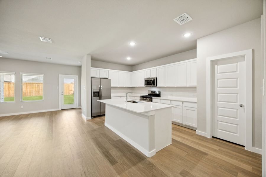 Kitchen in the Oscar home plan by Trophy Signature Homes – REPRESENTATIVE PHOTO Kitchen in the Oscar home plan by Trophy Signature Homes – REPRESENTATIVE PHOTO