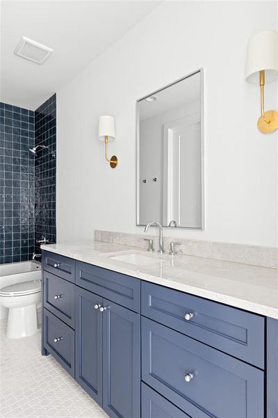 Full bathroom featuring vanity and shower / bath combination