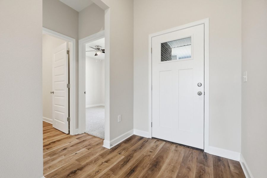 Photos of a similar home. Foyer
