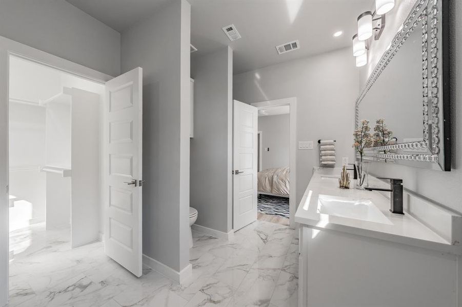 Bathroom with vanity and toilet