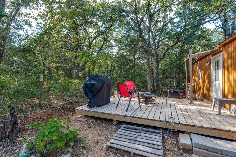 Wooden terrace with a grill