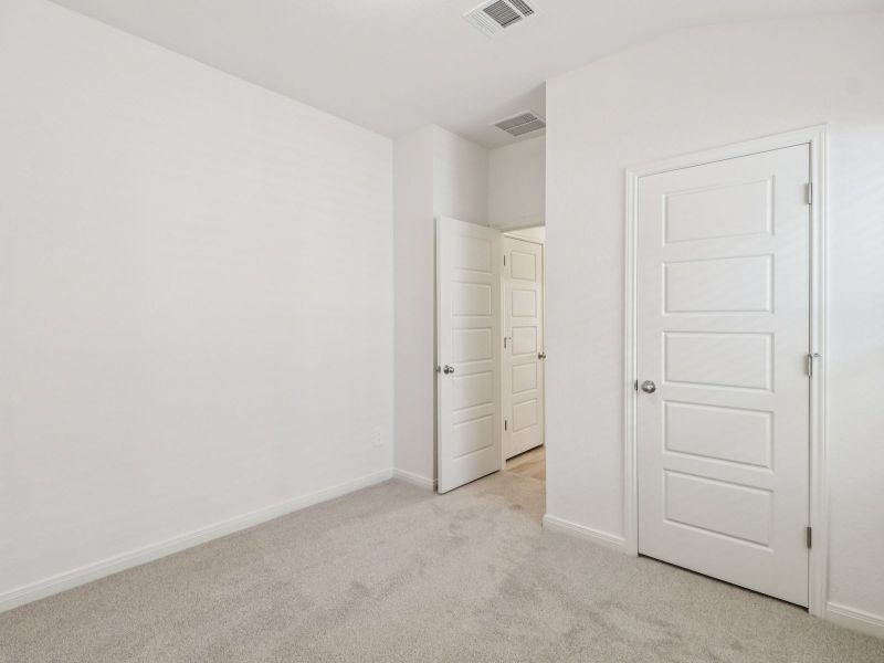 Guest bedroom in the Callaghan floorplan at a Meritage Homes community. Guest bedroom in the Callaghan floorplan at a Meritage Homes community.