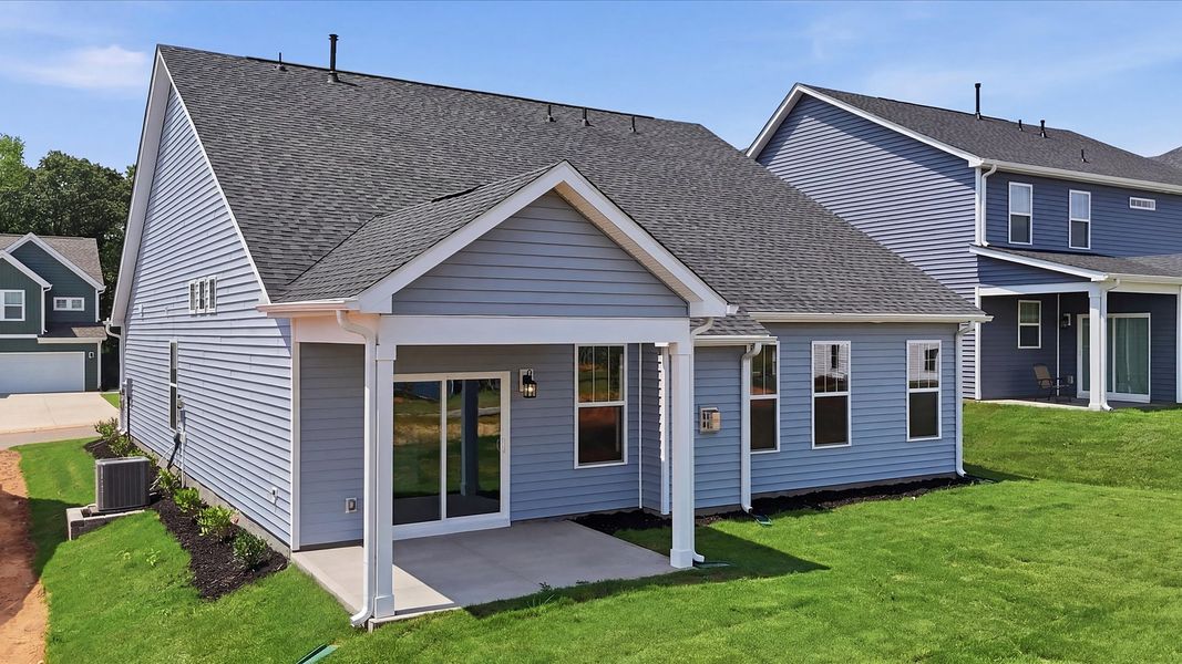 Elegant exterior with a rear covered porch—perfect for relaxing or entertaining outdoors at the Iris Meadows community Elegant exterior with a rear covered porch—perfect for relaxing or entertaining outdoors at the Iris Meadows community