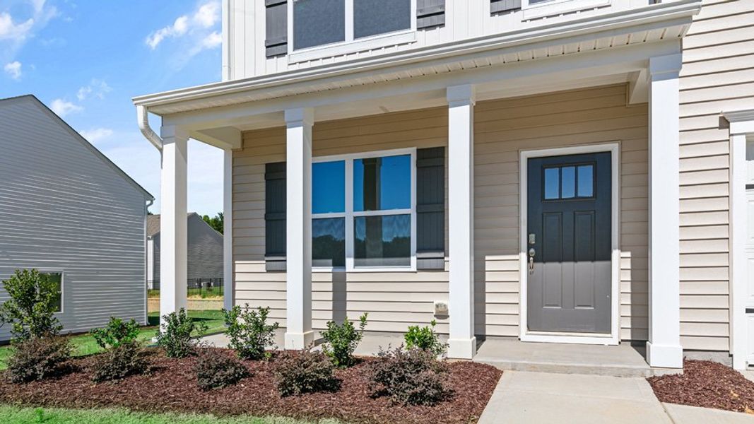 Exterior details and patio area of a home in East Ridge, Ayden (Image 3).