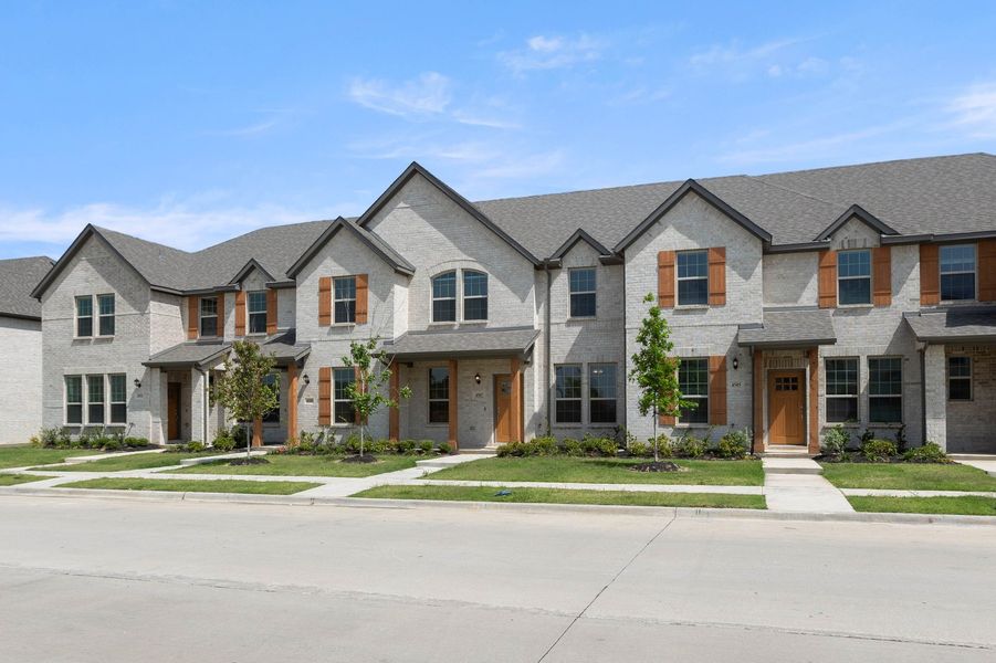 Front exterior of a new home in Sanger Circle – Townhomes, Sanger, TX, highlighting curb appeal (Image 2). Front exterior of a new home in Sanger Circle – Townhomes, Sanger, TX, highlighting curb appeal (Image 2).