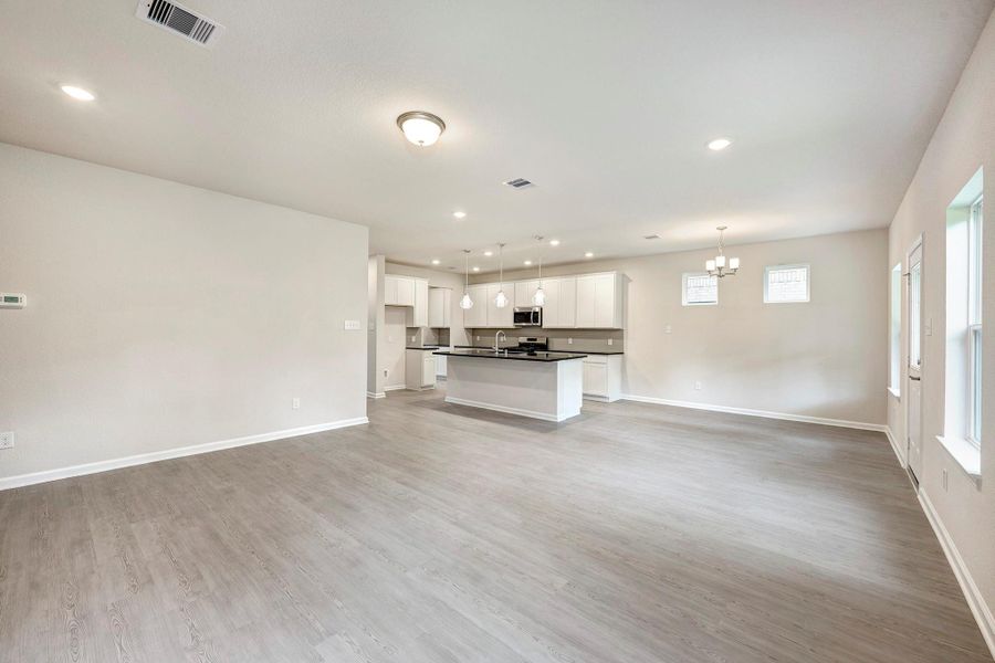 The James- Family Room into the Dining Area and Kitchen The James- Family Room into the Dining Area and Kitchen