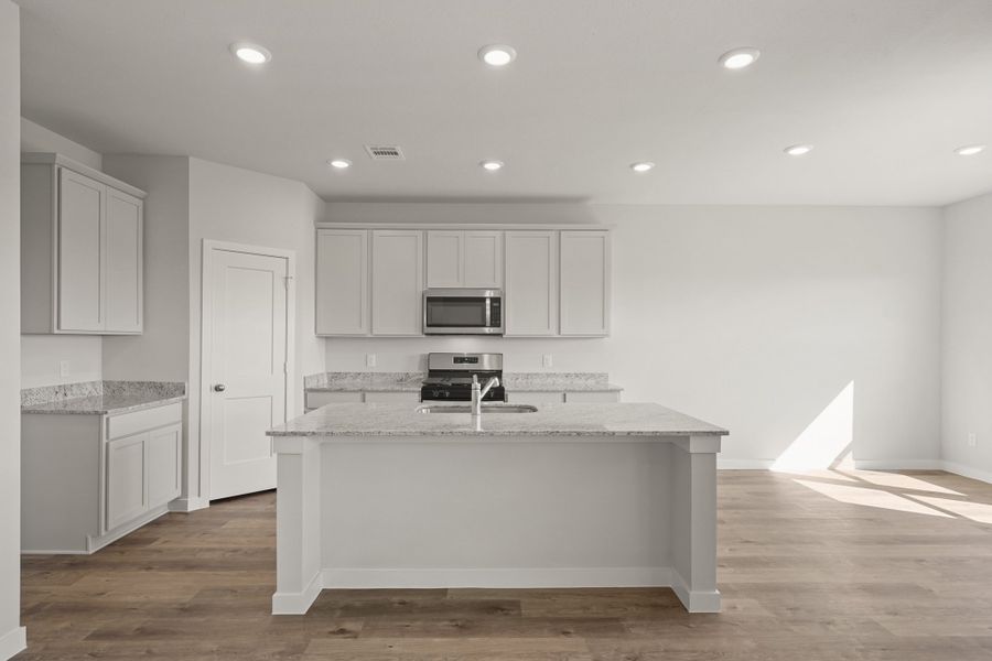 A kitchen with white cabinets. A kitchen with white cabinets.