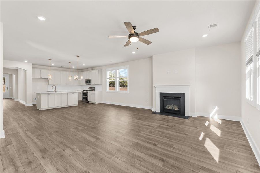 This bright and open space features a cozy firepla