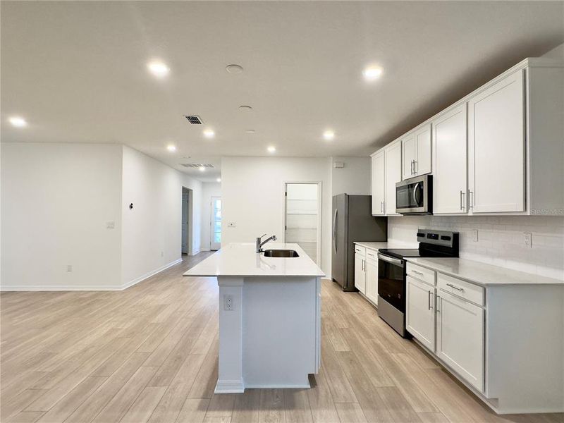 Furnished interior view inside a new home in Parkside Trails, Clermont (Image 9).