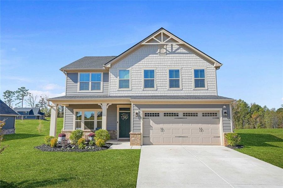 Front exterior of a new home in Southern Hills, McDonough, GA, highlighting curb appeal (Image 2).