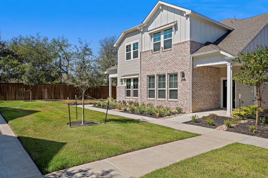 Front exterior of a new home in , Buda, TX, highlighting curb appeal (Image 17).