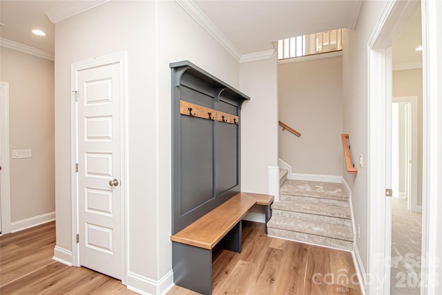 Custom wood drop zone adds a stylish and functional space for organization and convenience.