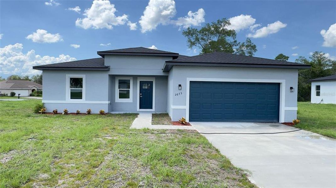 Front exterior of a new home in , Ocala, FL, highlighting curb appeal (Image 18). Front exterior of a new home in , Ocala, FL, highlighting curb appeal (Image 18).