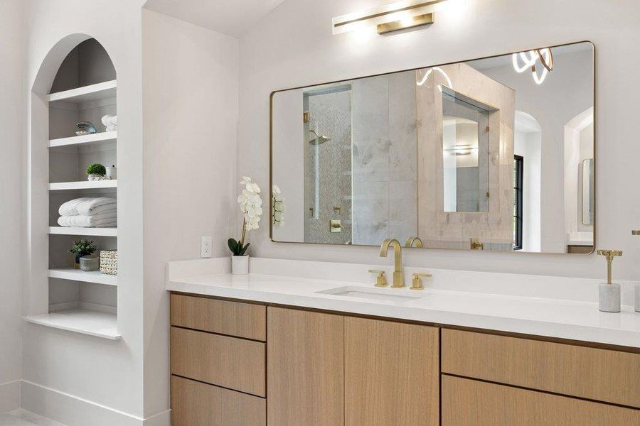 Bathroom vanity featuring wood-finish cabinetry and a white countertop