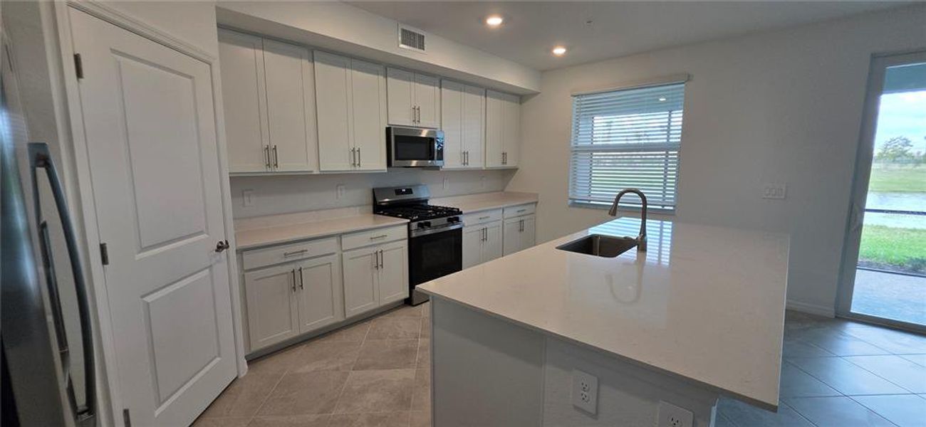 Furnished interior view inside a new home in Calusa Country Club, Lakewood Ranch (Image 5).