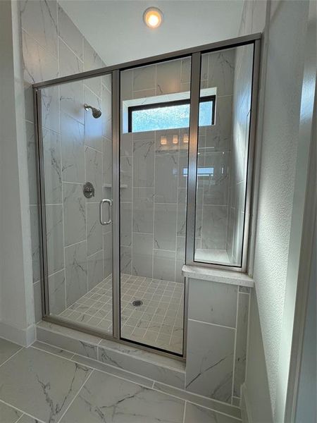 Bathroom featuring walk in shower