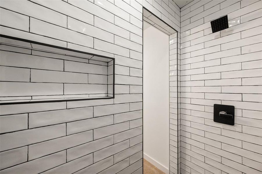 Bathroom featuring a tile shower