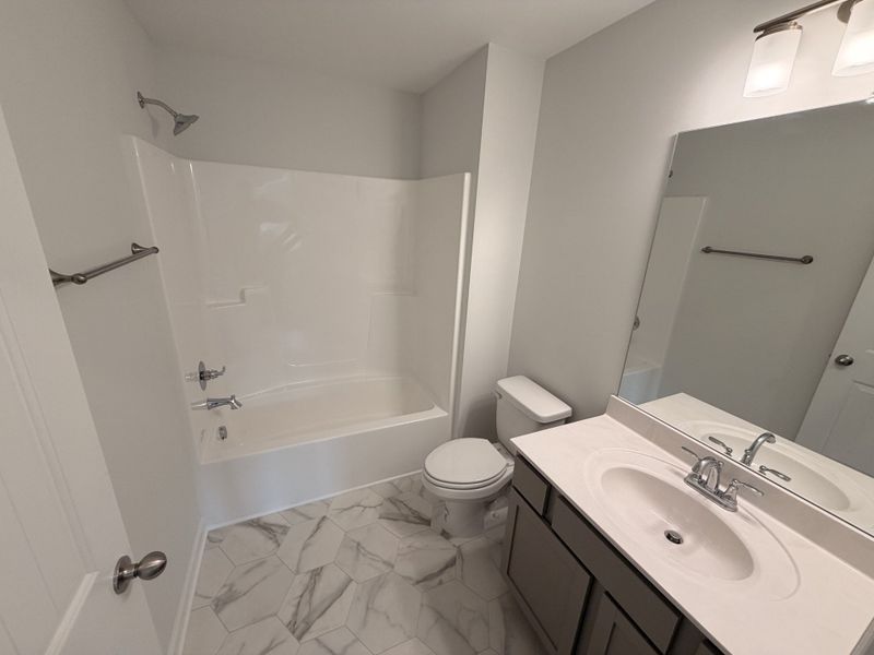 Bathroom #3 with the easy clean vinyl flooring and fiberglass tub/shower combo!