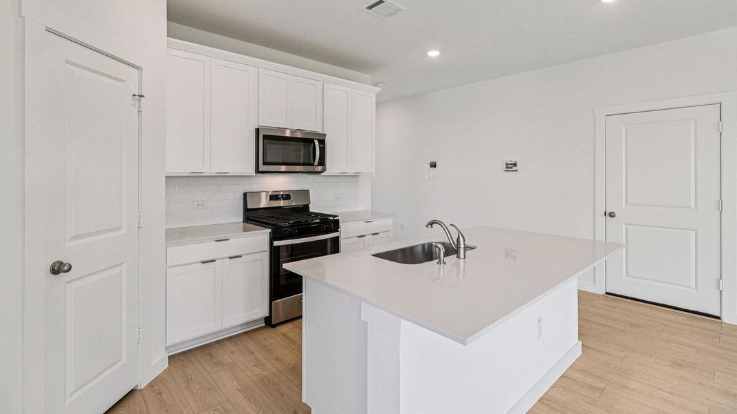 Furnished interior view inside a new home in Monarch Ranch, Manor (Image 6).