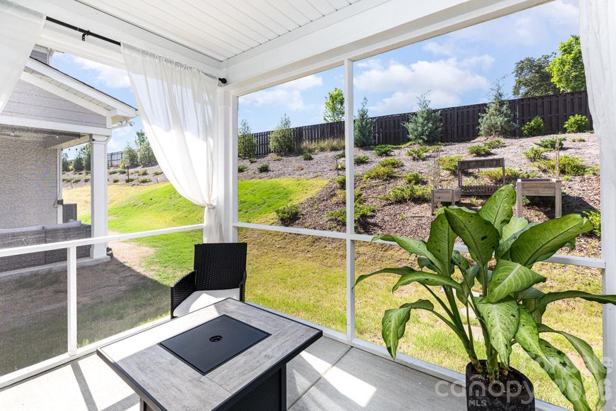 Exterior details and patio area of a home in Village at North Reach, Charlotte (Image 3).