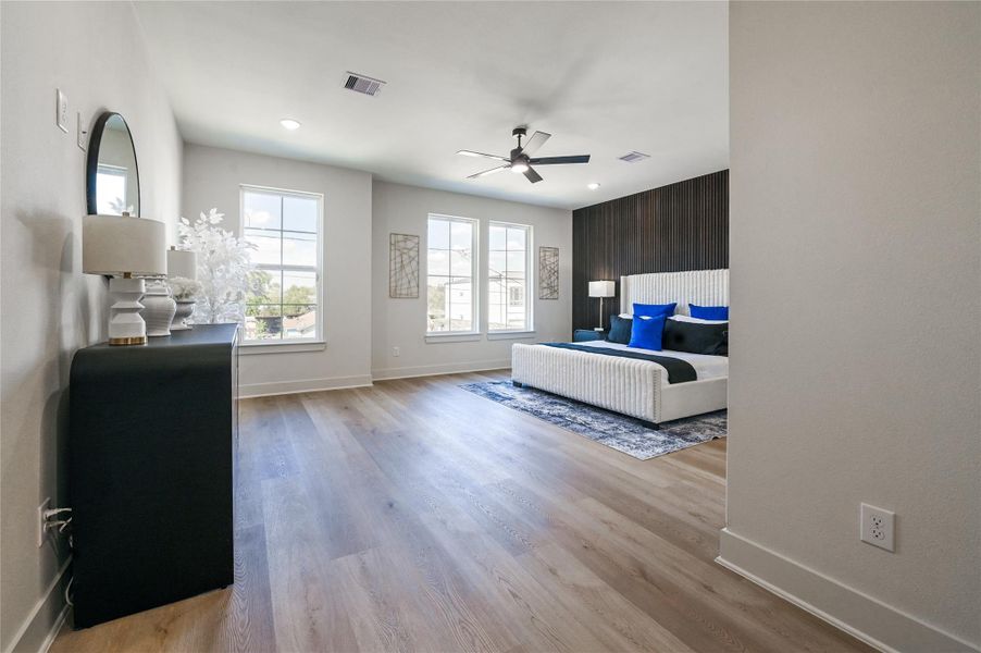 Grand primary bedroom is large enough for even the largest of furniture.
