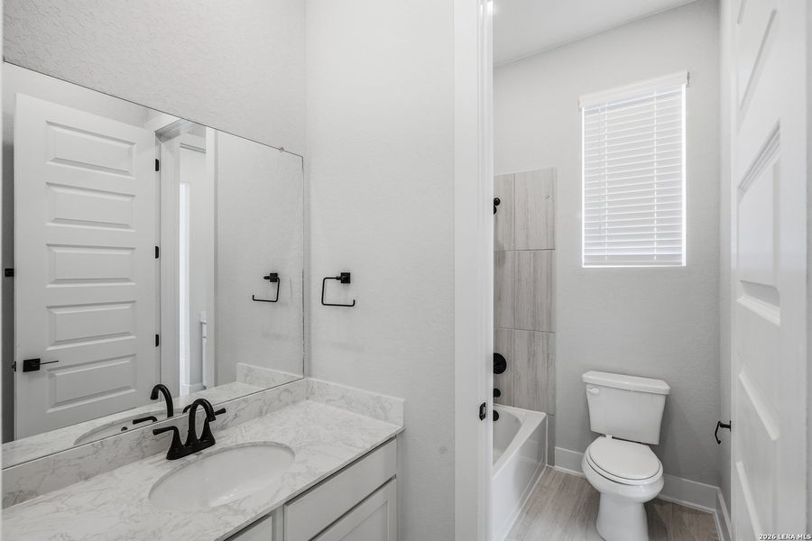 Furnished interior view inside a new home in Potranco Oaks, Castroville (Image 16).