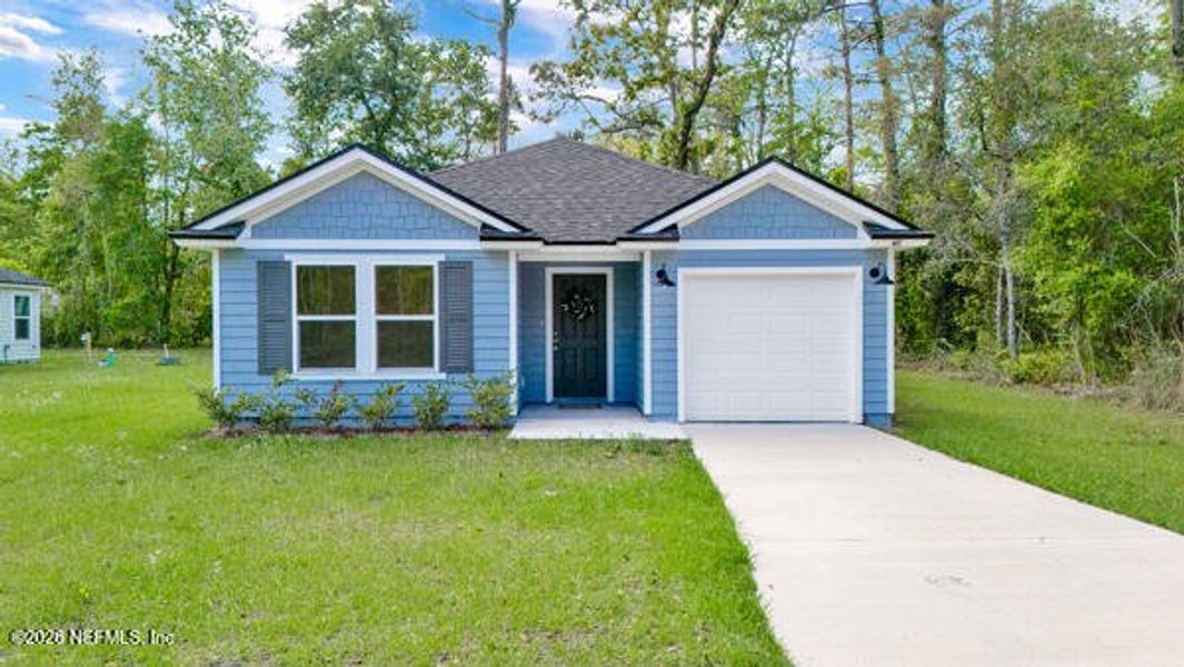 Front exterior of a new home in , Satsuma, FL, highlighting curb appeal (Image 27).