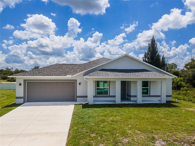 Front exterior of a new home in , Lehigh Acres, FL, highlighting curb appeal (Image 1). Front exterior of a new home in , Lehigh Acres, FL, highlighting curb appeal (Image 1).