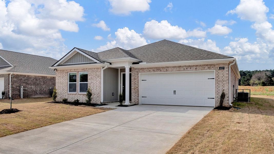 Front exterior of a new home in Huntington Estates, Millington, TN, highlighting curb appeal (Image 22).