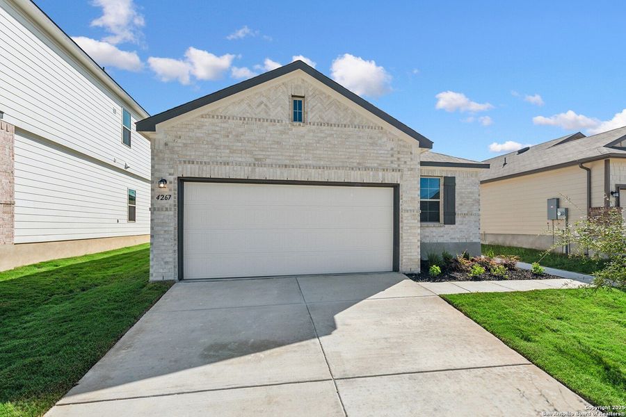 Front exterior of a new home in Park Place, New Braunfels, TX, highlighting curb appeal (Image 16).